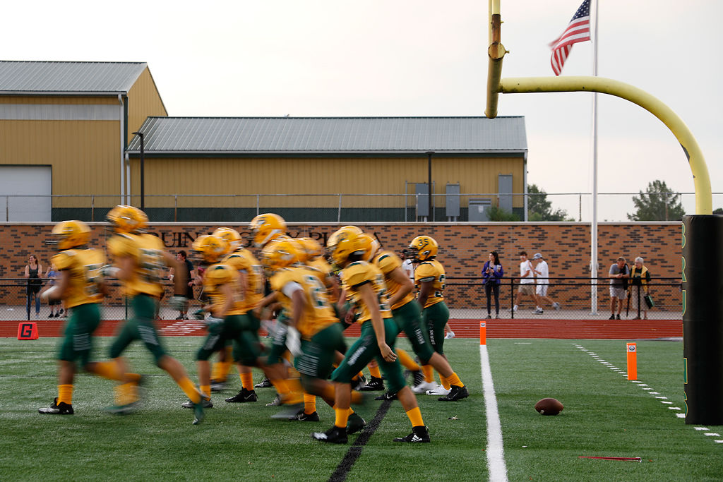 The Rock Bridge football team warms up